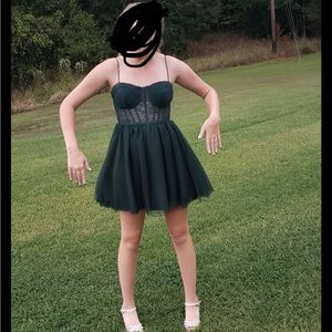 This beautiful dark green dress that has a corset top.